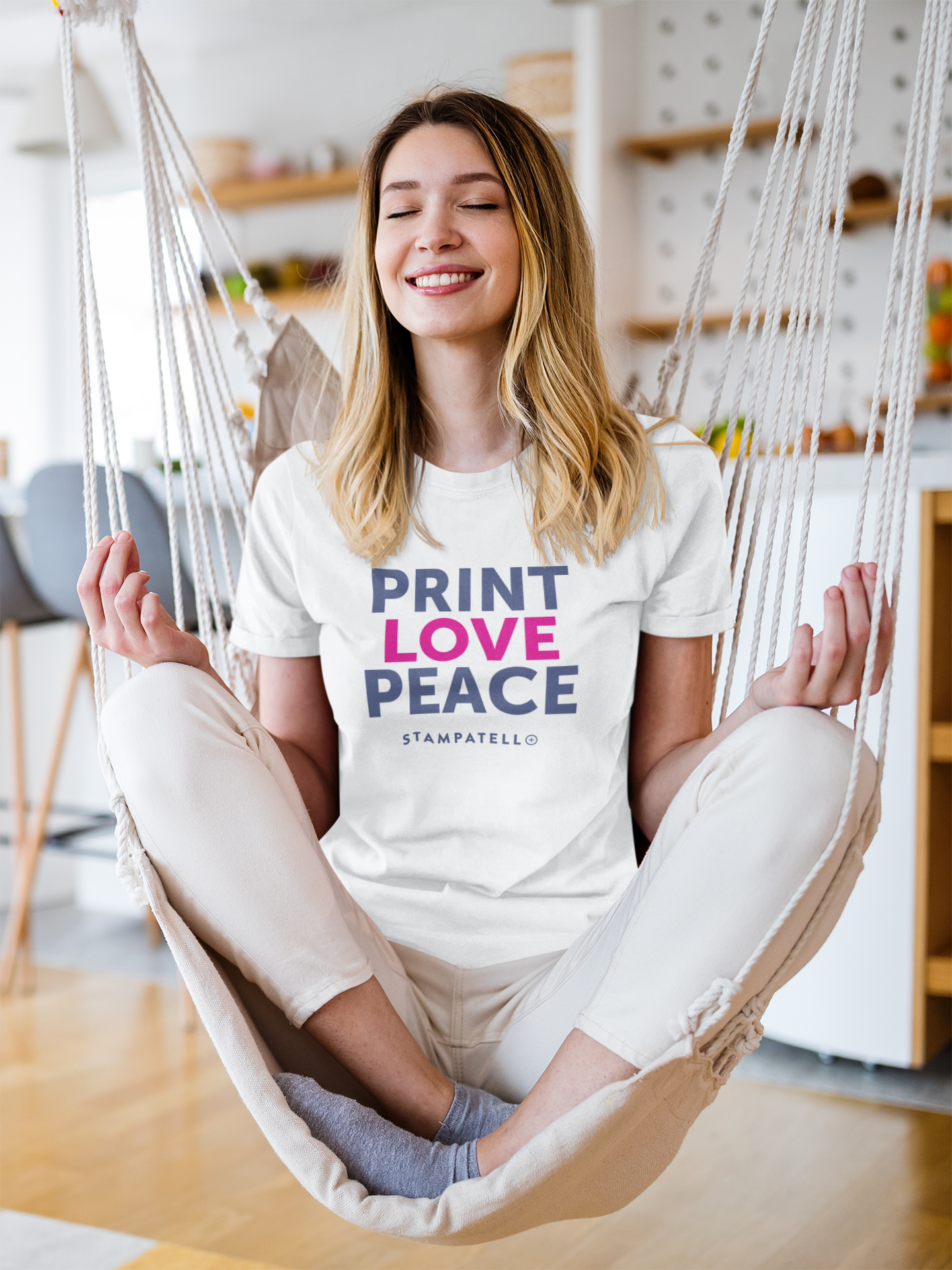 t-shirt-mockup-of-a-smiling-woman-meditating-on-a-hammock-at-home-m2198-r-el2.png